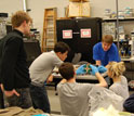 The scientific team assemblying the RAX cubesat.