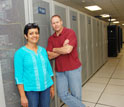 Photo of Jay Aikat and Michael Reiter in a machine room.