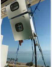 Photo of instruments for measuring atmospheric mercury on a balcony facing the Dead Sea.