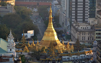 Pagoda in Myanmar surrounded by buildings