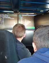 scientists studying radar images of a blizzard inside the Doppler-on-Wheels.