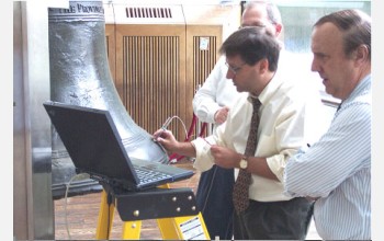 Steve Arms conducts initial measurements on the Liberty Bell.
