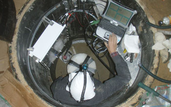 Photo of an engineer testing the station after the electronics are installed.