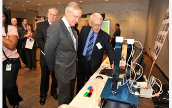 Photo of Sen. Reid with shake table that simulates earthquake motions.