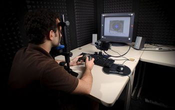 man with computer doing eye-tracking experiment