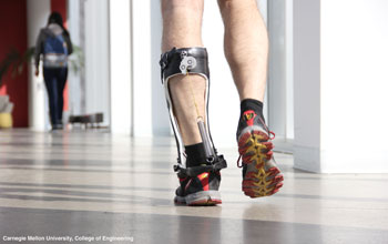 photo showing a man's legs with a robotic prosthesis