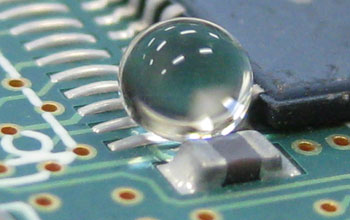 A water droplet on a waterproofed circuit board.