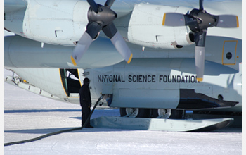 Photo of a ski-equipped Hercules LC-130 refueling in Antarctica.