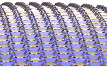 Low magnification SEM image of interconnected Si photodetector pixels and electronics on substrate.