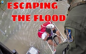 person being rescued from flood