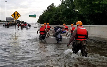First responders performing rescues during floods from Hurricane Harvey's rains