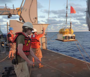 Deployment of an ocean bottom seismograph from the research vessel Thompson.