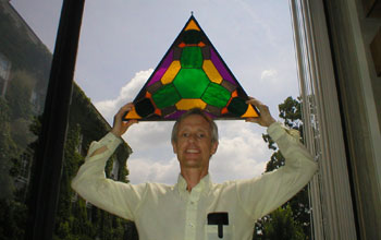 Frank Morgan holding stained glass reproduction