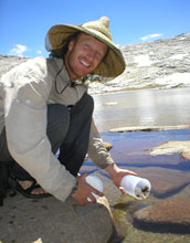 Photo of scientist Vance Vredenburg with one of the frogs he and colleagues study.