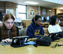Photo of students using  digital game-based learned on computers.