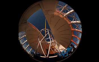 A 180-degree fisheye view of the Gemini North Telescope on Mauna Kea, Hawaii, lit by moonlight