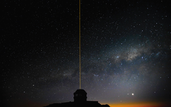 Gemini South Telescope in Chile is seen with laser blazing during laser operations