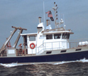 Dobbs, Lyons and colleagues collect water samples from a research vessel.