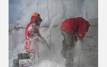 Shawn Doyle (left) and Tim Brox use chainsaws to excavate sampling chamber inside Taylor Glacier.