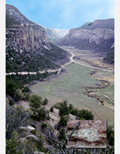 Photo of Unaweep Canyon in the Rockies , the site of a deep gorge. Inset shows a dropstone.