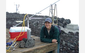 Photo of David Noone by a vapor-collecting cryospheric trap near the Mauna Loa Observatory.