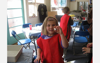 Photo of a student showing off her home-made bouncy ball at The Discovery Museums, Acton, Mass.