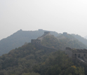 Photo of Great Wall of China near Beijing obscured by air pollution, dust and sand.