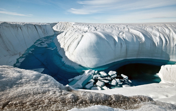 A Greenland ice canyon filled with meltwater in summer 2010.