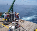 Scientists collecting water samples from the Gulf of Mexico.