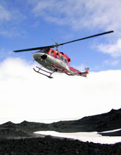 A Bell 212 helicopter, owned by Petroleum Helicopters Inc., lands at Cape Royds in Antarctica