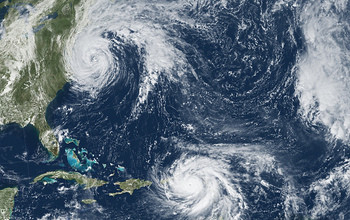 Satellite view of hurricanes off the US East Coast and in the Caribbean.