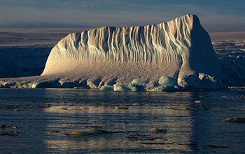 An iceberg near Palmer Station during the dim twilight during a few hours of sunlight