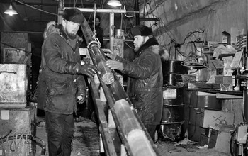 Engineers pull up a section of the 4,560-foot-long ice core at Camp Century in the 1960s.