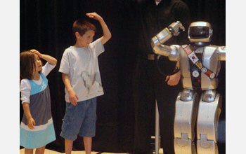 Children play "Simon Says" with Jaemi, a humanoid robot (HUBO)
