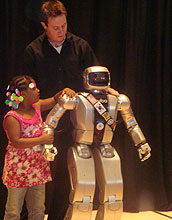 A little girl and robot Jaemi HUBO, with researcher