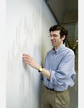 Jon Kleinberg of Cornell University in front of a tree diagram used in the research project.