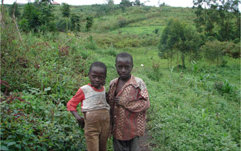 Photo of two children at the edge of Kibale National Park, Uganda.