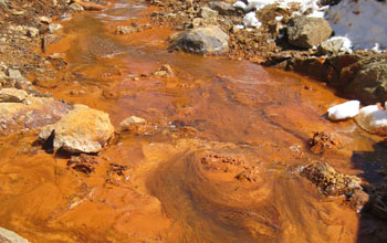 Photo of a metal-rich acid-mine-drainage from a mine near Lake Fork Creek, Colo.