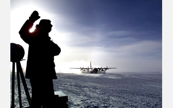 Worker waves goodbye as LC-130 leaves South Pole with winter staff