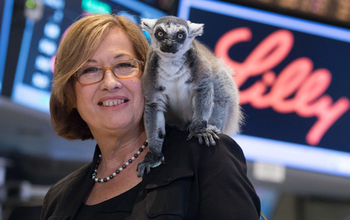 Patricia Wright shouldering a lemur