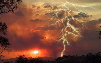 lightning in the sky above a wildfire