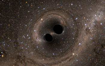 The collision of two black holes is seen in this still from a computer simulation