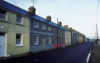 row houses along a street in a working class neighborhood.
