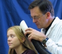 Biologist Dale Clayton demonstrates the LouseBuster.