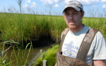 Scientist Matthew Kirwan doing research in Chesapeake Bay wetlands.