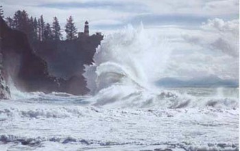 Oceans send plumes of sea spray into the atmosphere as waves hit a rocky coast