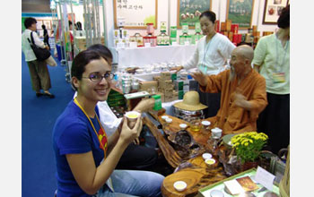 Photo of cultural anthropologist Margie Serrato learning how to properly drink tea in South Korea.