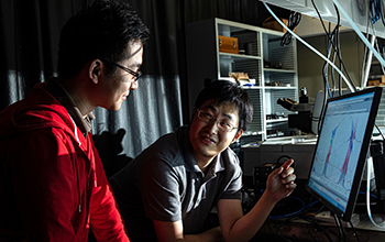 graduate student Xinwei Li, left, and postdoctoral researcher Weilu Gao