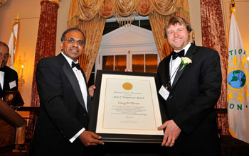 Photo of NSF Director Subra Suresh presenting the Alan T. Waterman Award to Casey Dunn.