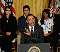 President Obama with a group of young people seated behind him